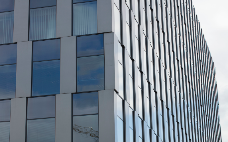 glass facades, Improved Natural Light, Improved Aesthetics, glass facade fixing details, glass facade building design